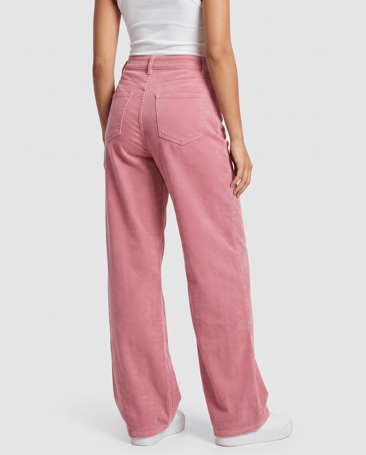 Rear view of pink wide-leg trousers from a slight angle showing the relaxed leg