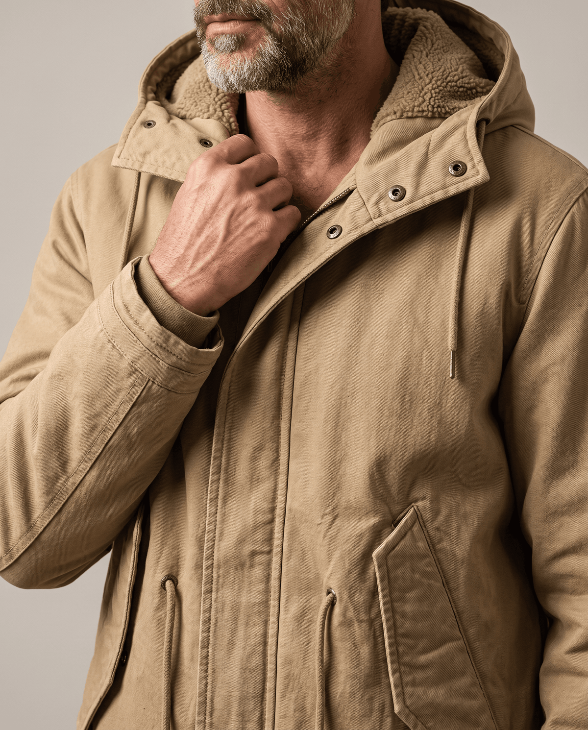 Men's khaki cotton hooded parka, flap pocket and collar close-up