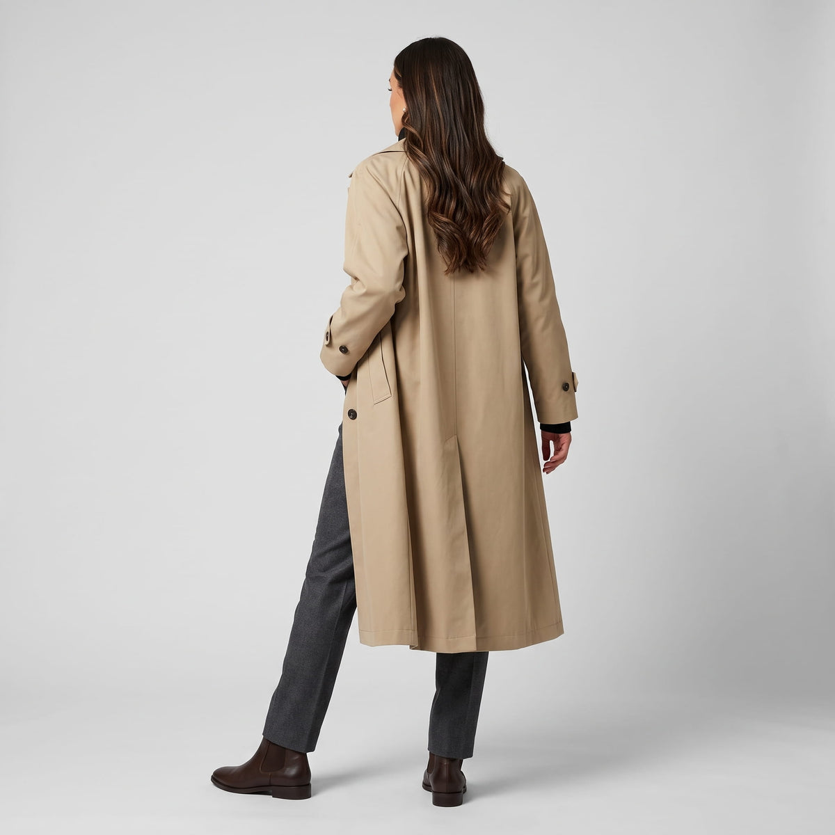 Back view of khaki coat showing the straight cut and center back vent