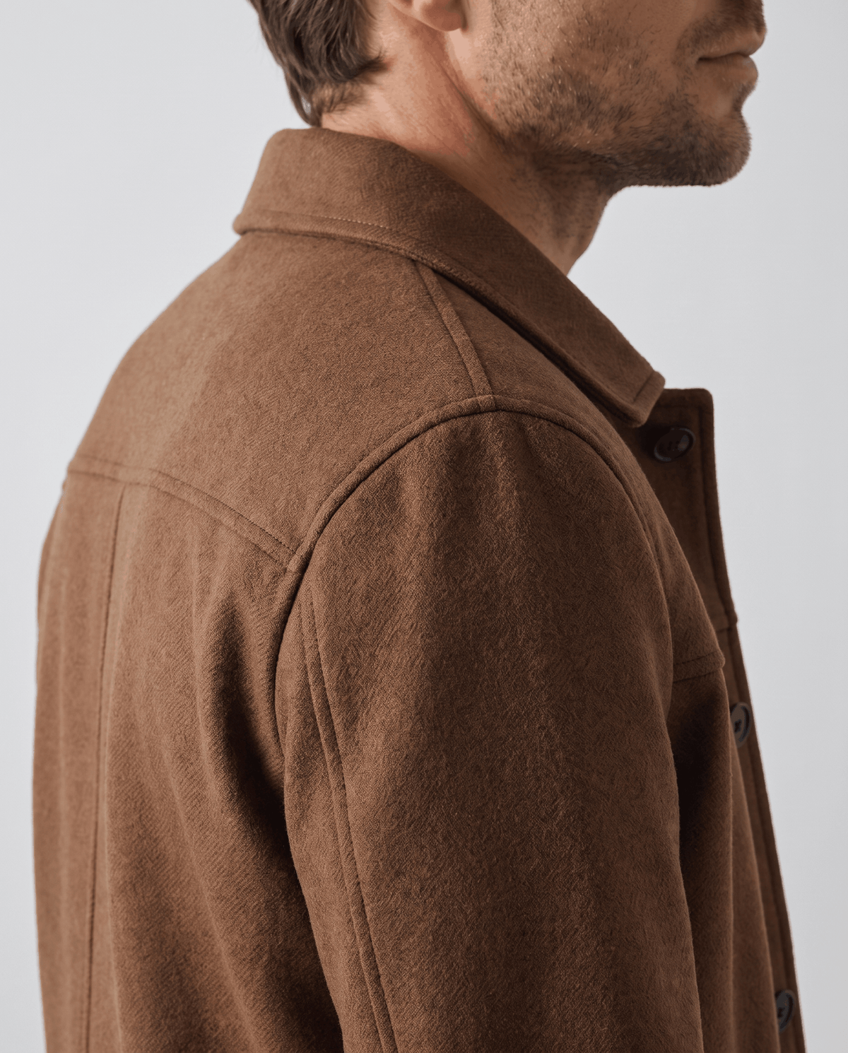 Close view of the brushed camel fabric and the flat point collar