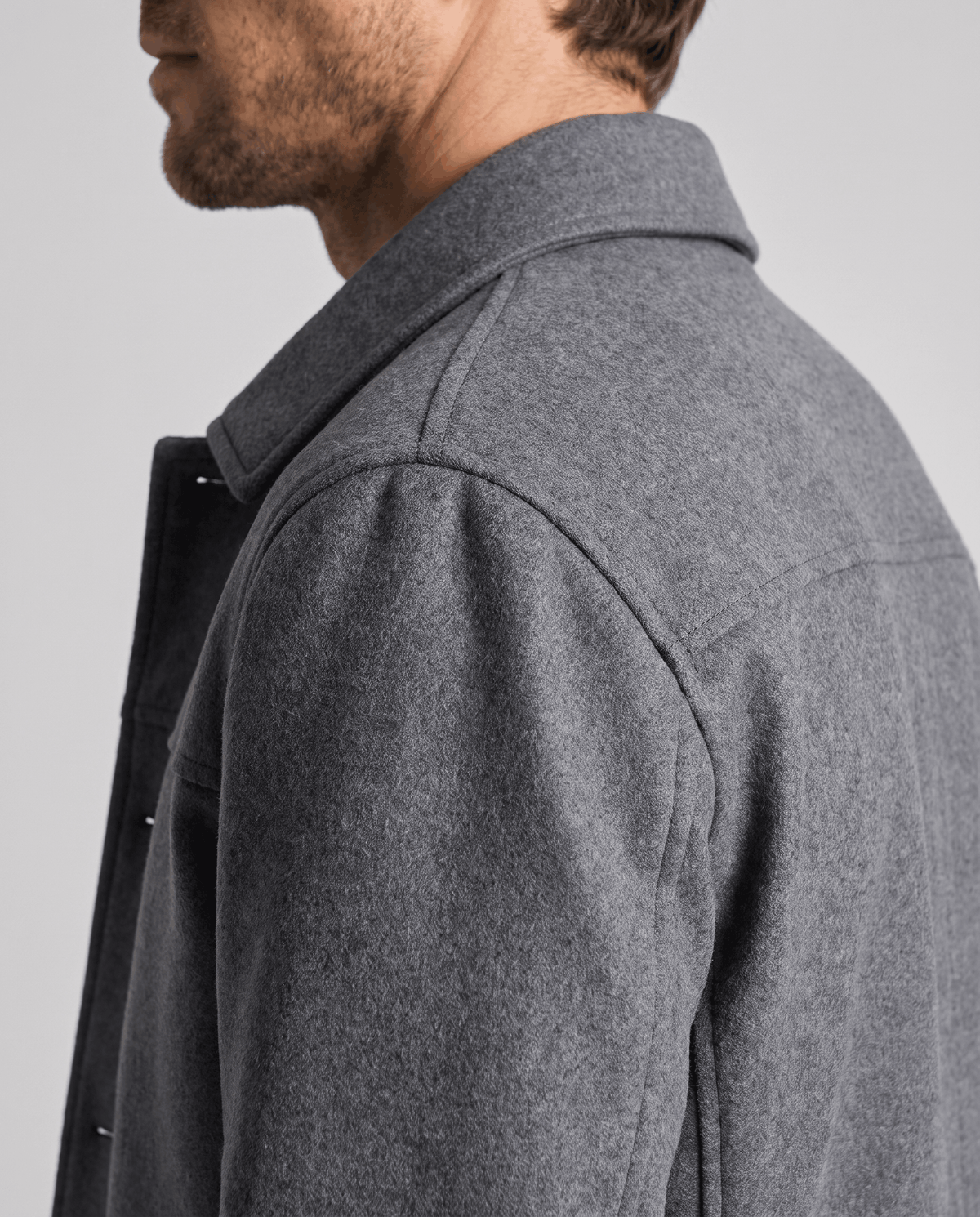 Close crop of the gray brushed weave across the shoulder and sleeve head