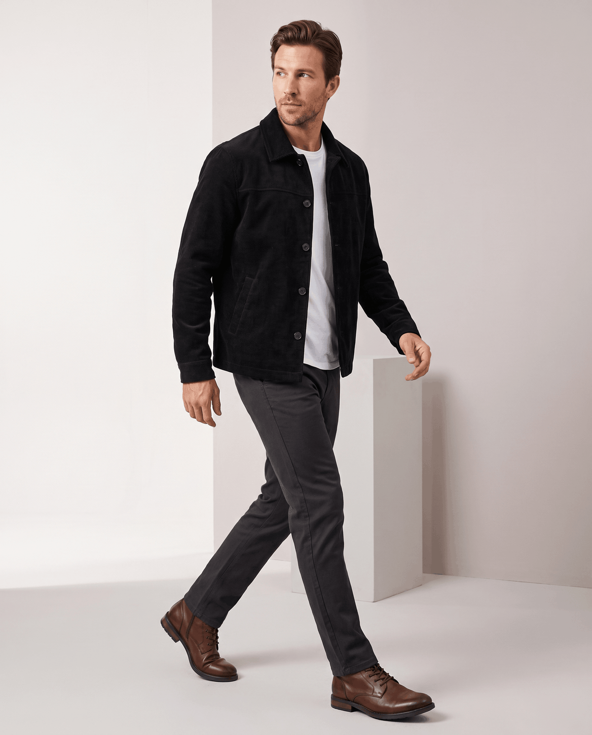Gray jacket worn open with the point collar turned down flat