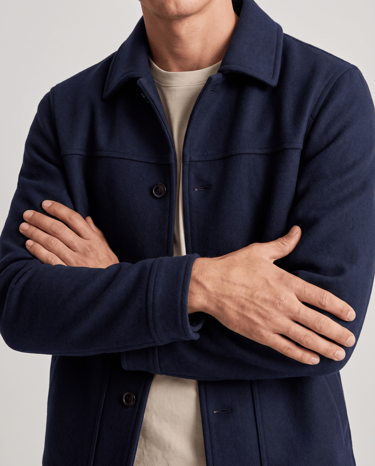 Navy jacket sleeve and cuff detail in close crop