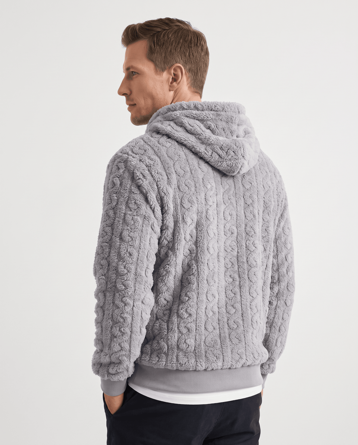 Back of gray hoodie with hood up on the shoulders and cable pattern