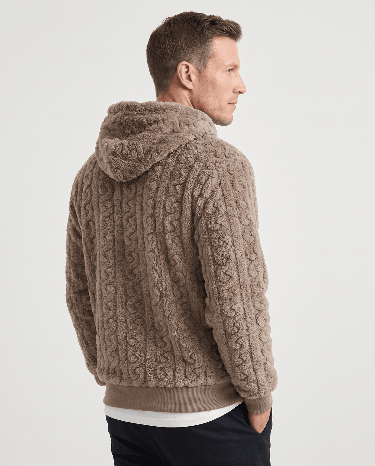Back of taupe hoodie showing the hood, cable pattern and ribbed hem