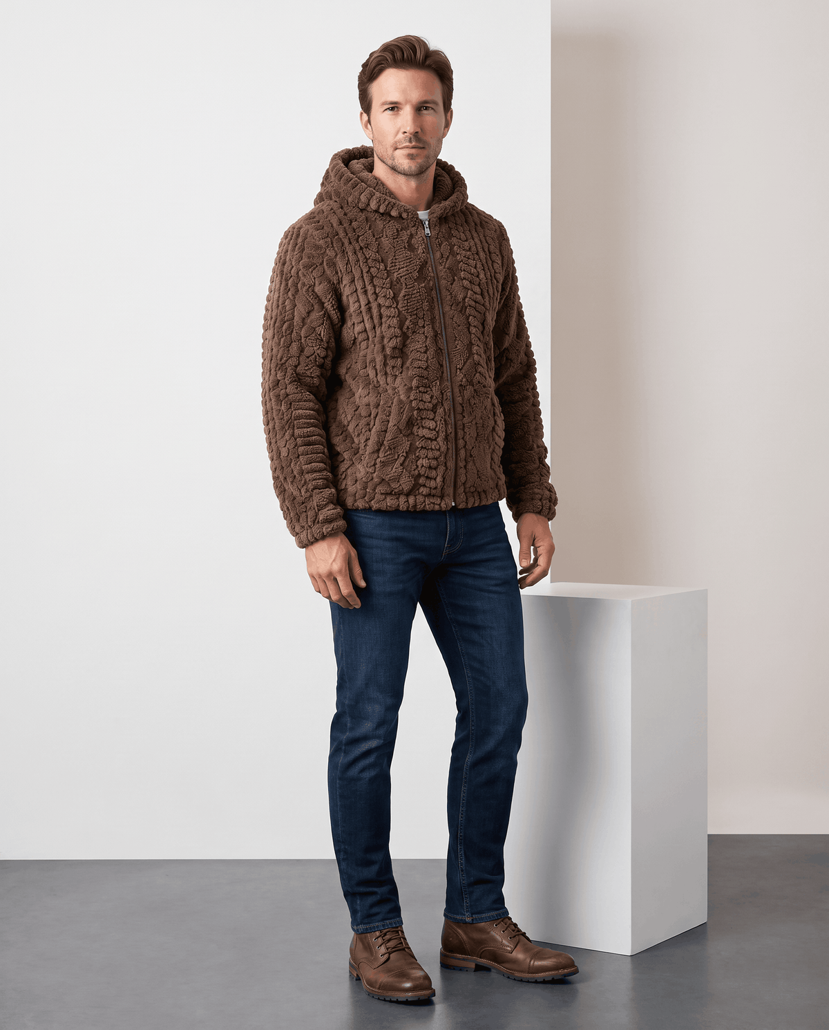 Full-length view of dark brown hooded jacket styled with jeans and brown shoes