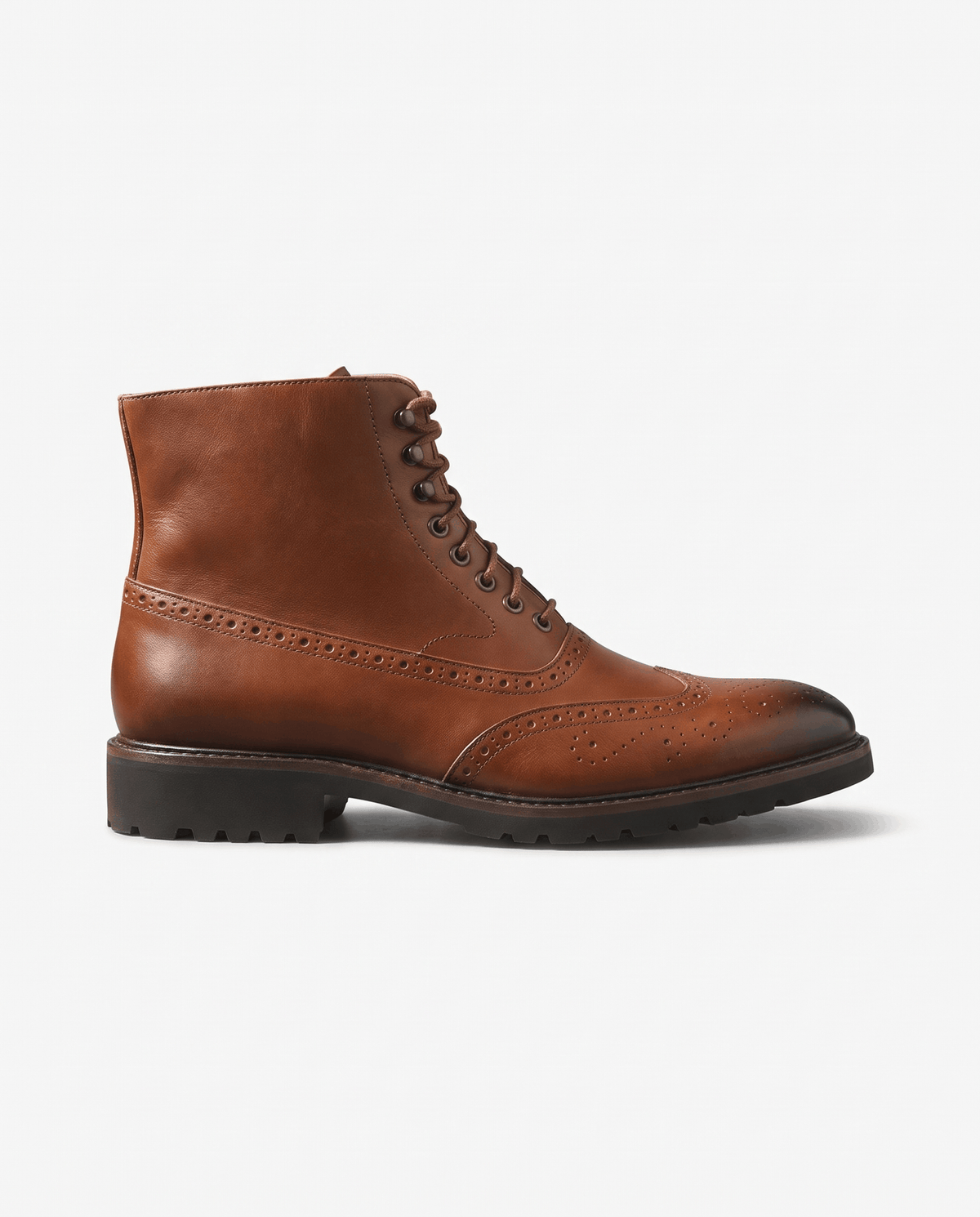 Brown smooth leather ankle boot in profile on a plain light background