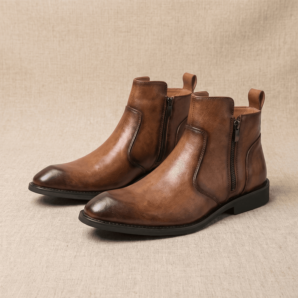 Burnished brown leather dress boots with a pointed toe, inside zip closure, and a slim stacked block heel.
