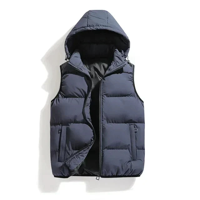 Blue-gray padded vest with detachable hood and front pockets laid flat