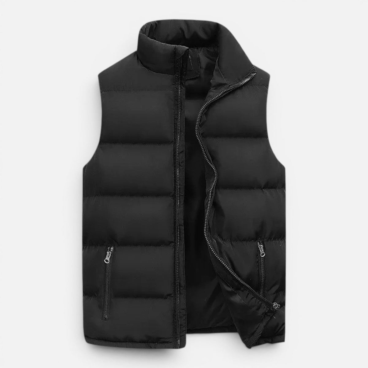 Black quilted vest laid flat with front open, showing zippered pockets and dark lining