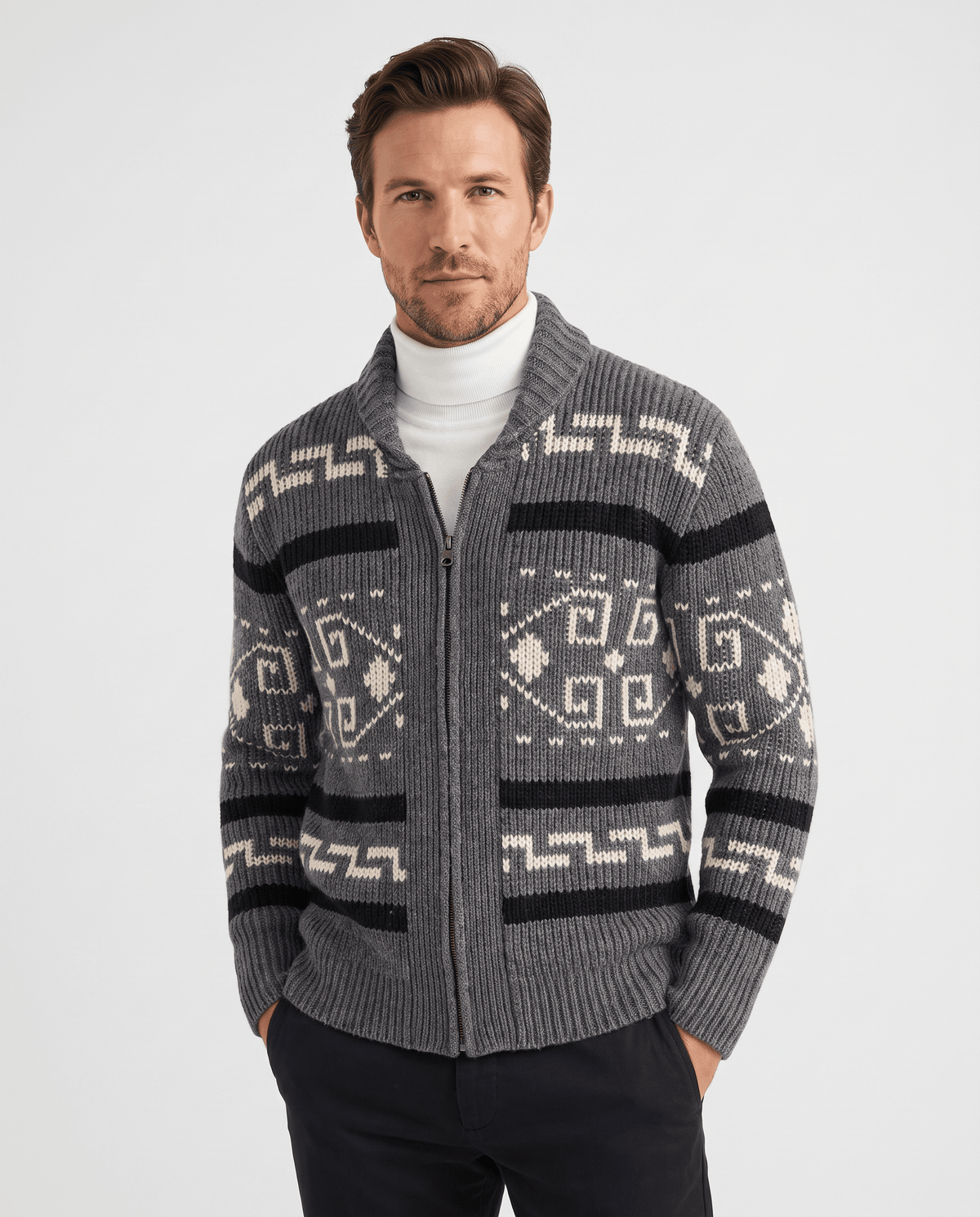 Men's gray geometric jacquard zip cardigan with shawl collar worn over a white turtleneck