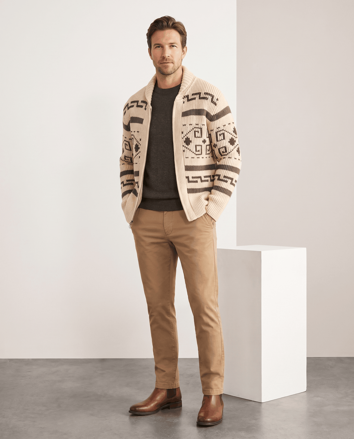 Full-length look with khaki jacquard cardigan, tan trousers and brown shoes