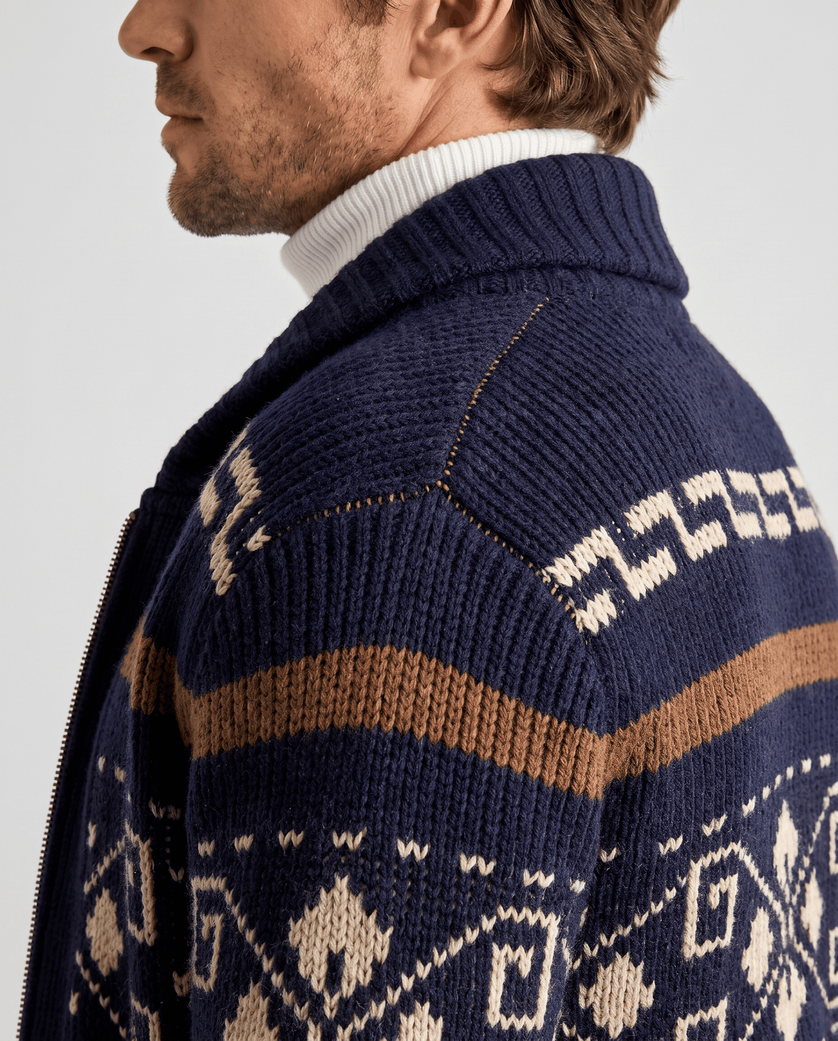 Side close view of navy blue cardigan shawl collar and geometric pattern