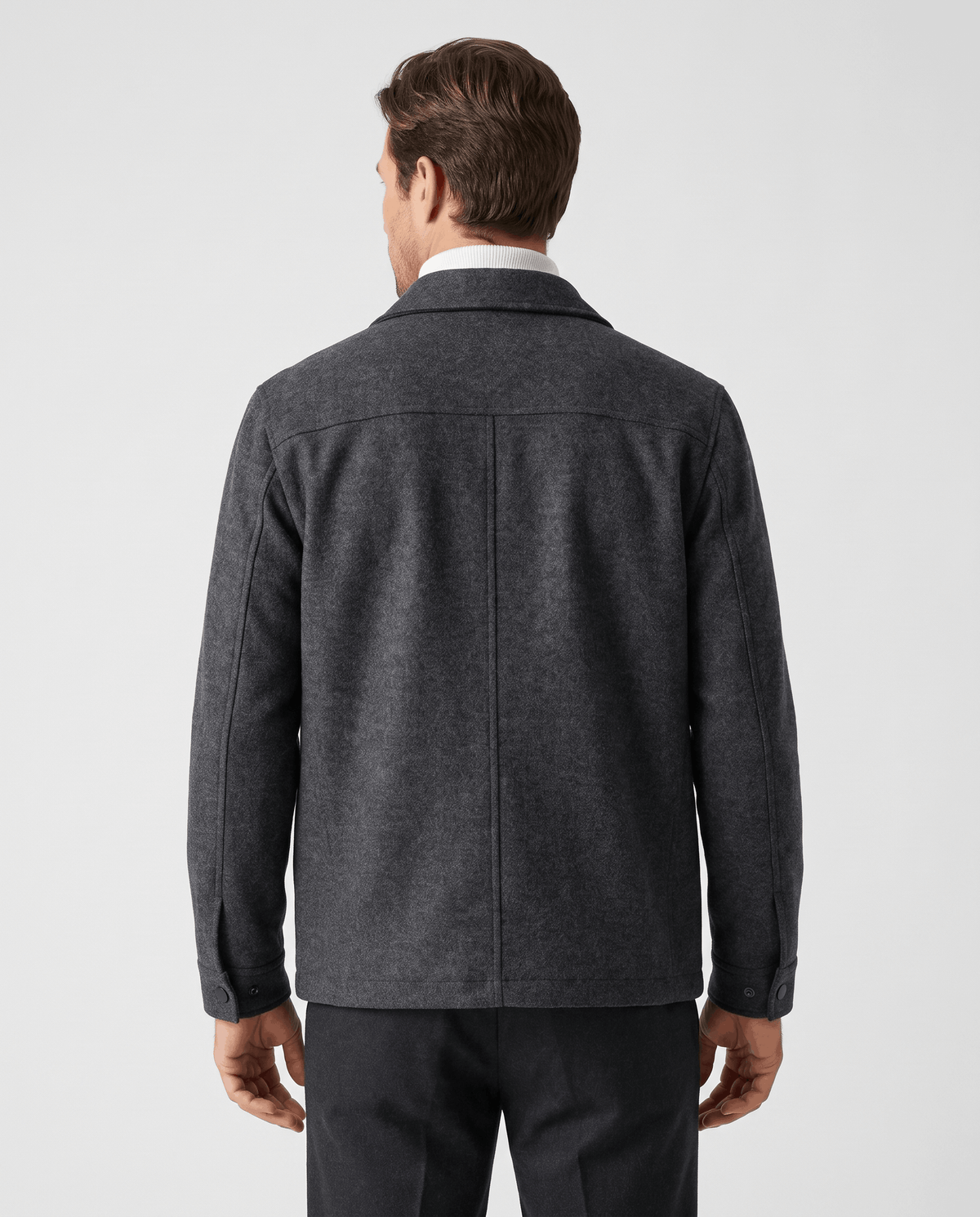 Full back view of the jacket, plain panel and straight hem at the hip
