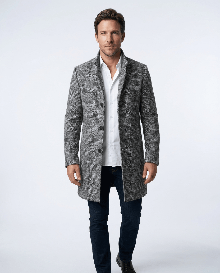 Front view of the light gray and black herringbone overcoat worn with a white shirt