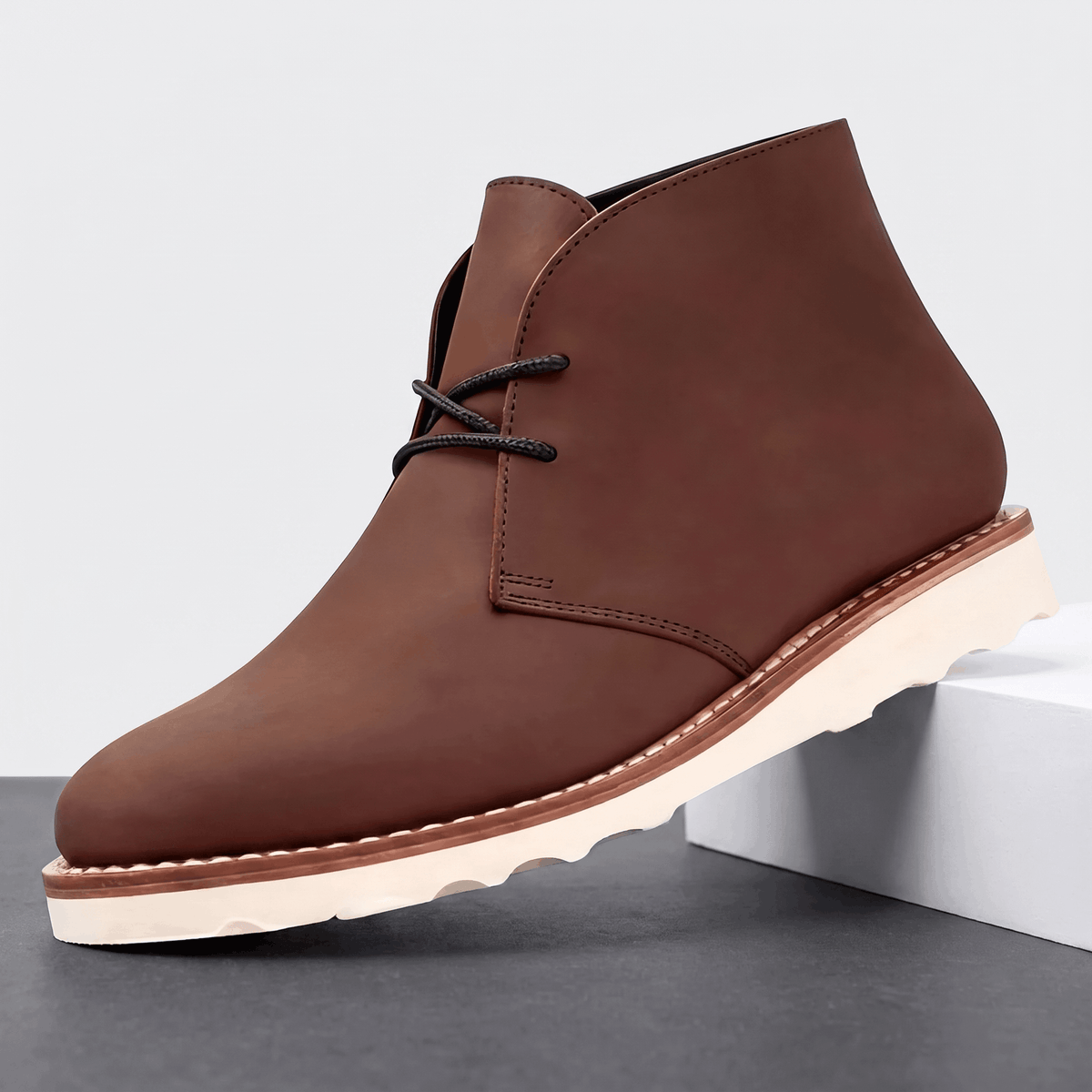 Rounded toe and matte upper on a men's two-eyelet chukka boot.