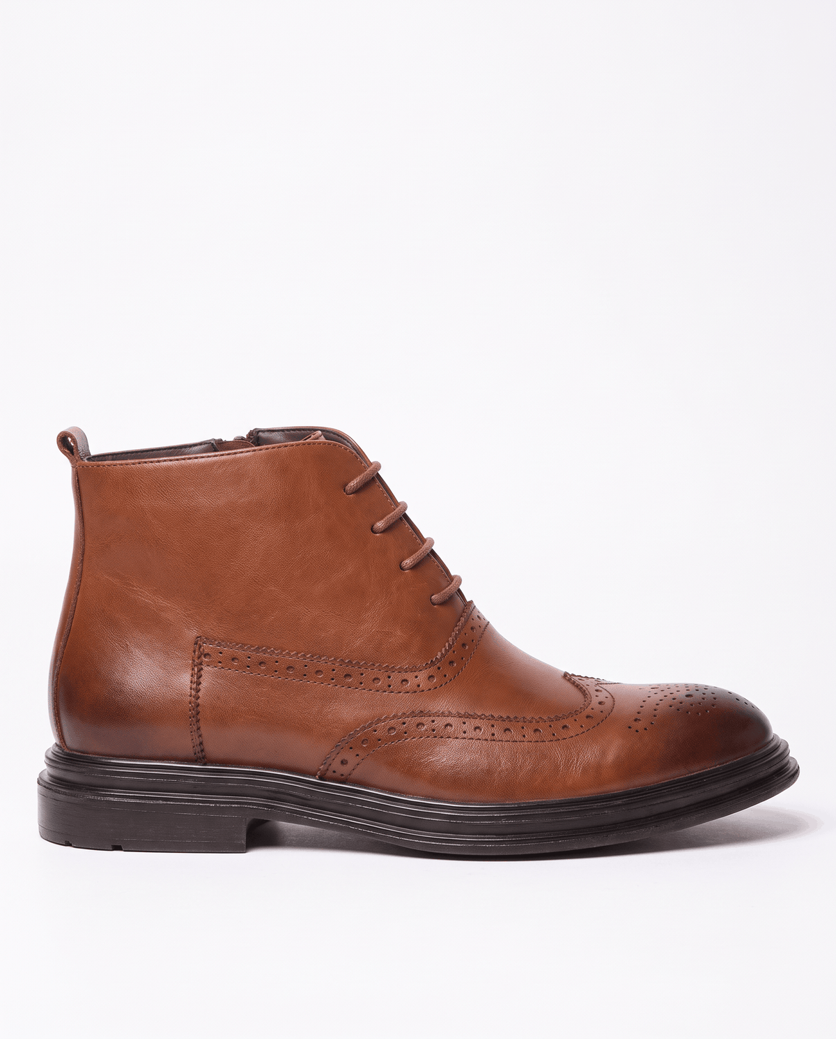 Side view of a brown leather ankle boot showing the zip and brogue detailing