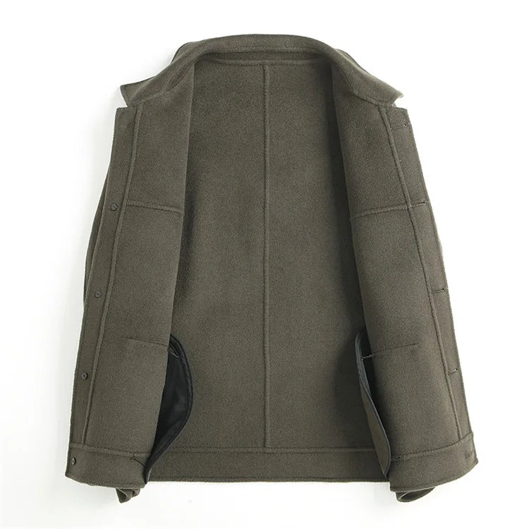 Olive green jacket on a hanger viewed from the back showing sleeve shaping