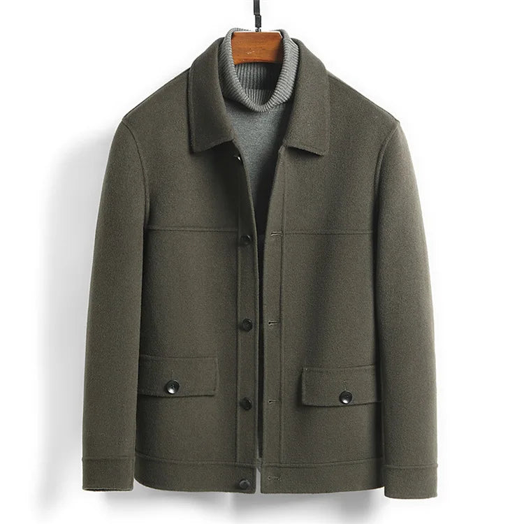Olive green jacket on a hanger viewed from the front with pockets visible