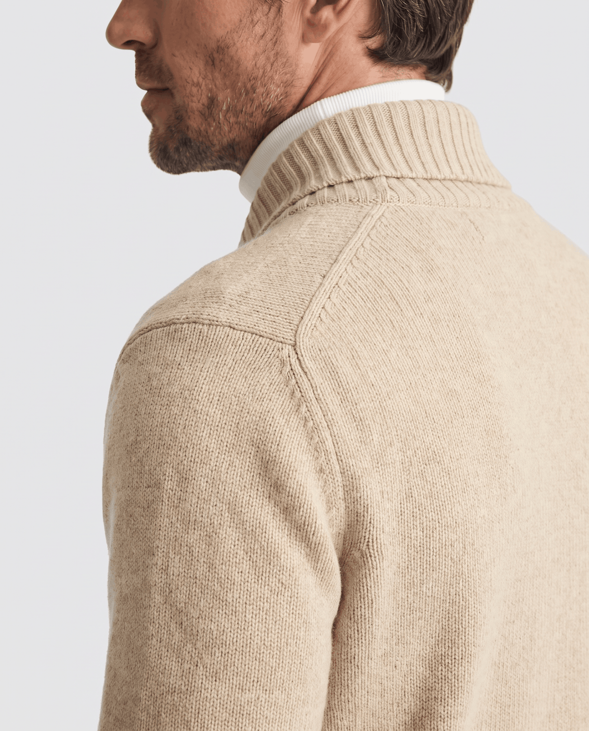 Close back view of apricot cardigan shawl collar and shoulder