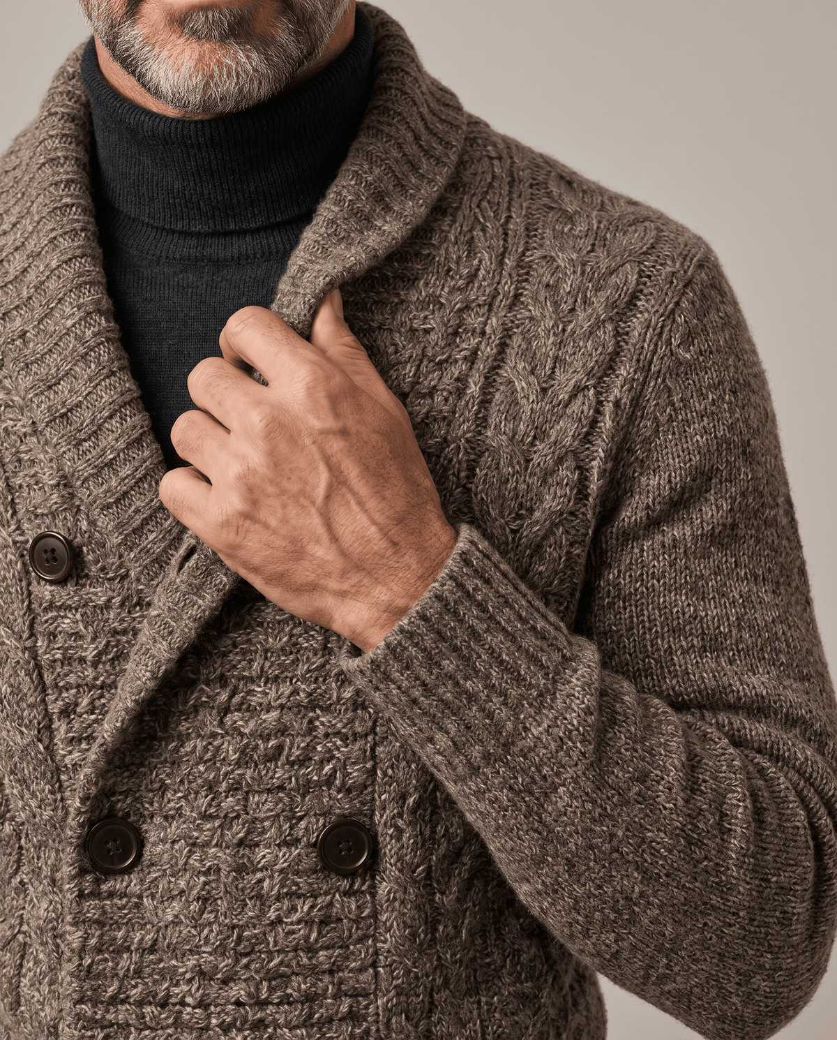 Dark brown cardigan shawl collar and double-breasted buttons with textured knit, close view
