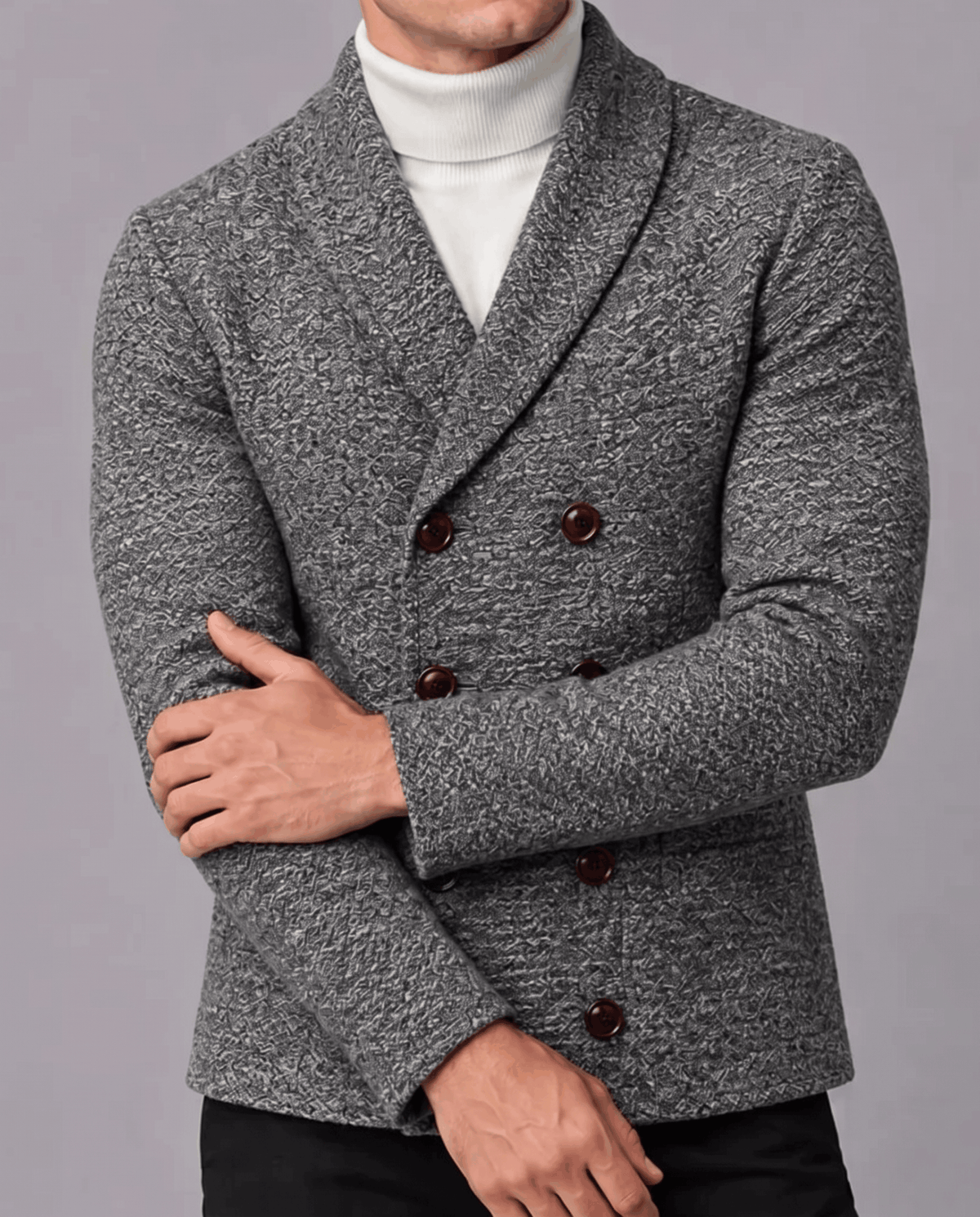 Dark gray double-breasted cardigan with arms crossed showing textured knit and buttons