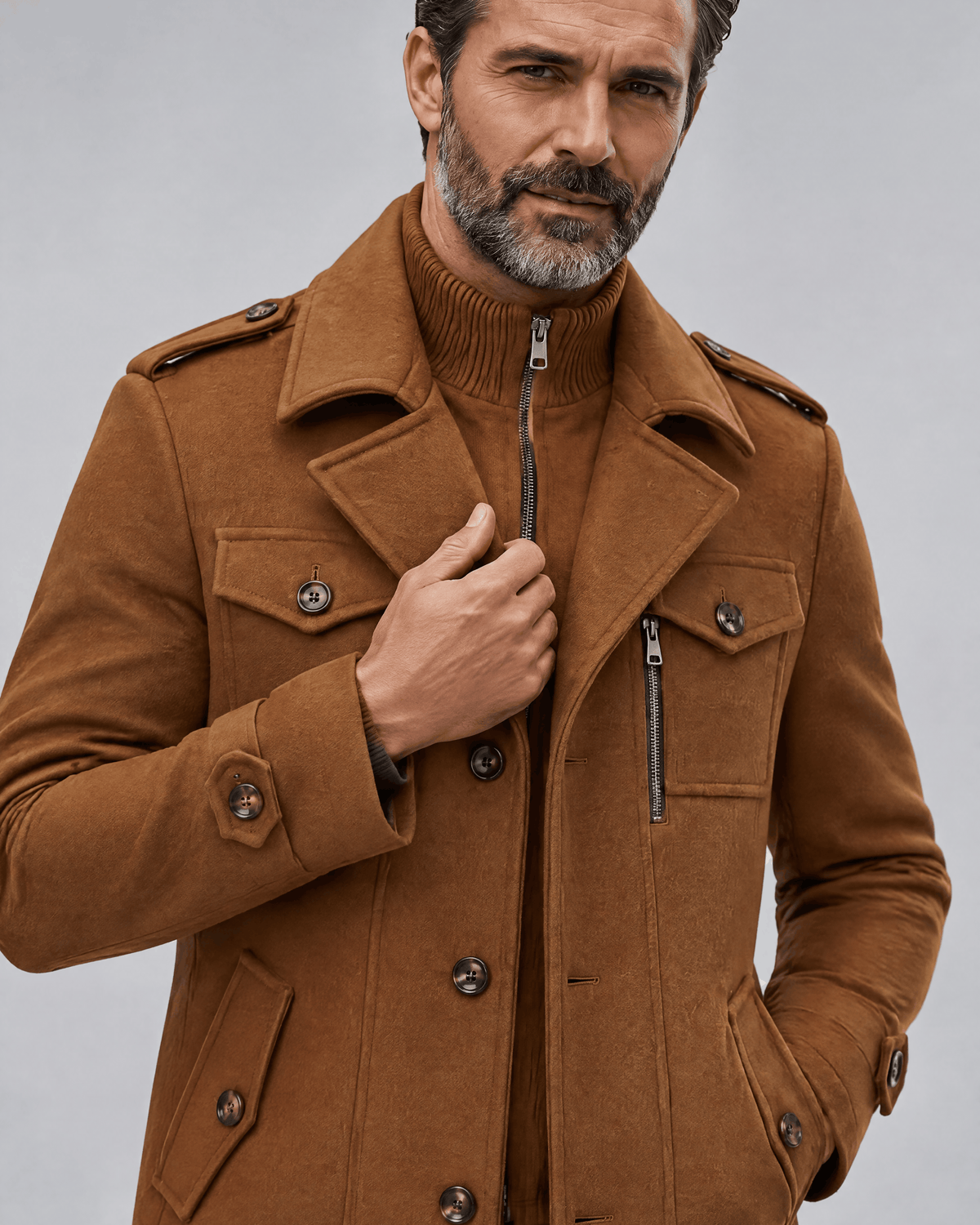 Close-up of the caramel coat's zip-in knit bib, chest pocket flaps and shoulder epaulettes