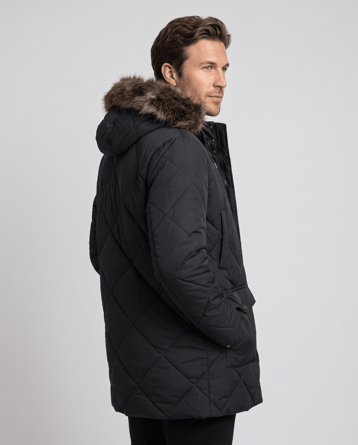 Men's black quilted long parka, back view
