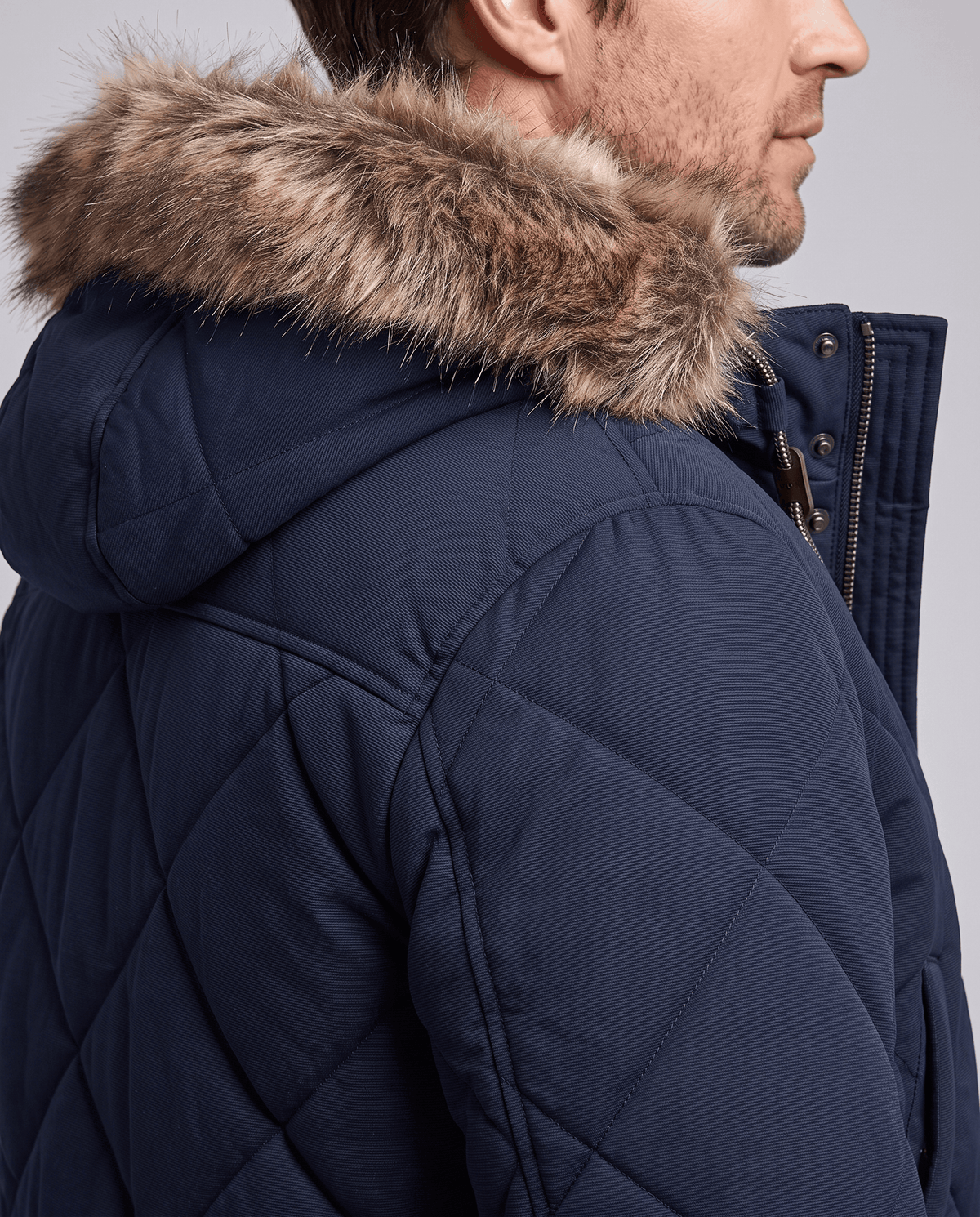 Men's navy blue quilted long parka, fur-trim hood detail