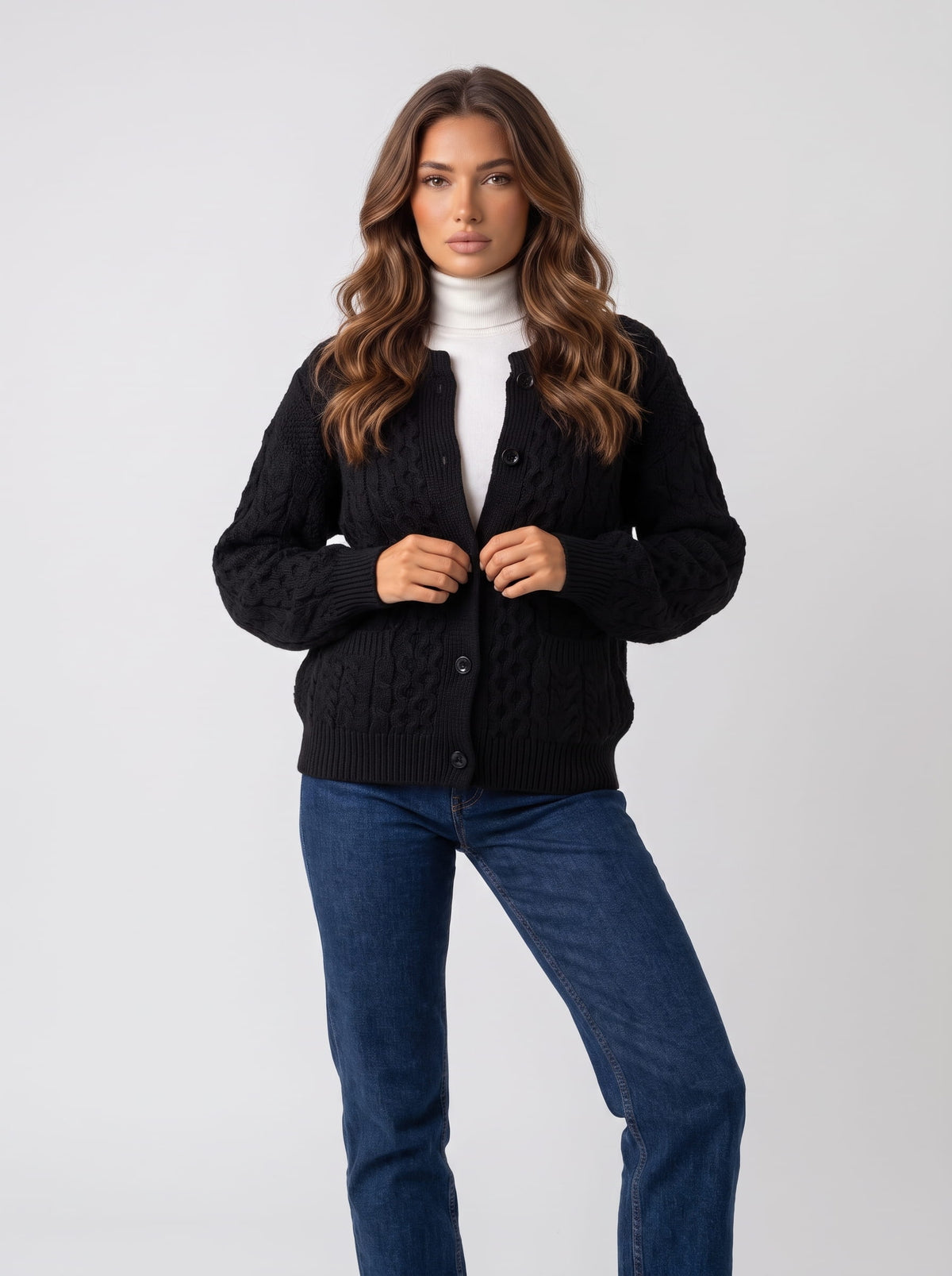 Full-length look with black cable-knit cardigan and blue jeans