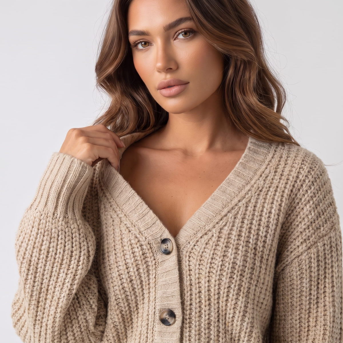 Beige chunky knit cardigan V neckline and button front shown in close view
