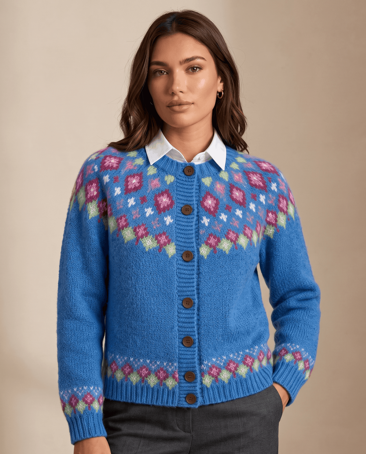 Woman wearing a blue Fair Isle yoke cardigan over a white collared shirt