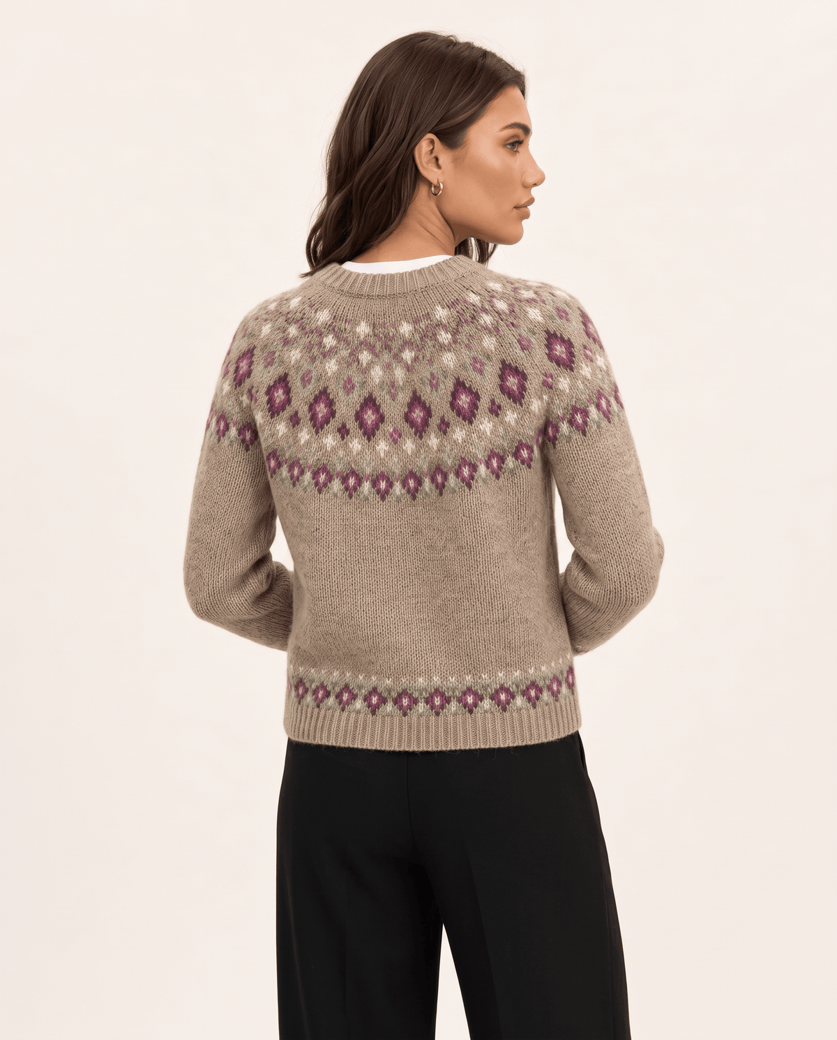 Back view of a camel Fair Isle cardigan with a patterned yoke and hem