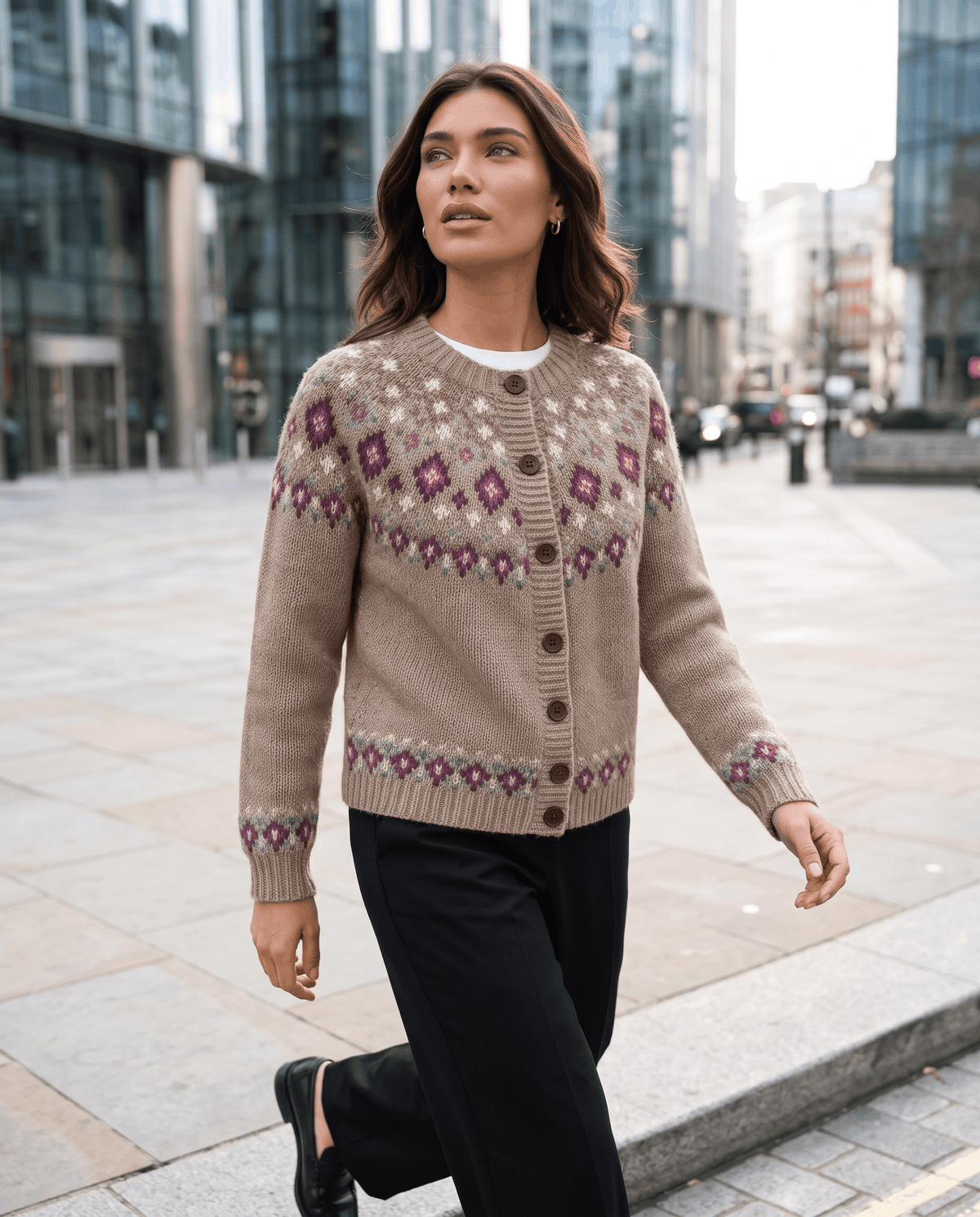 Camel Fair Isle cardigan styled with black trousers on a city street