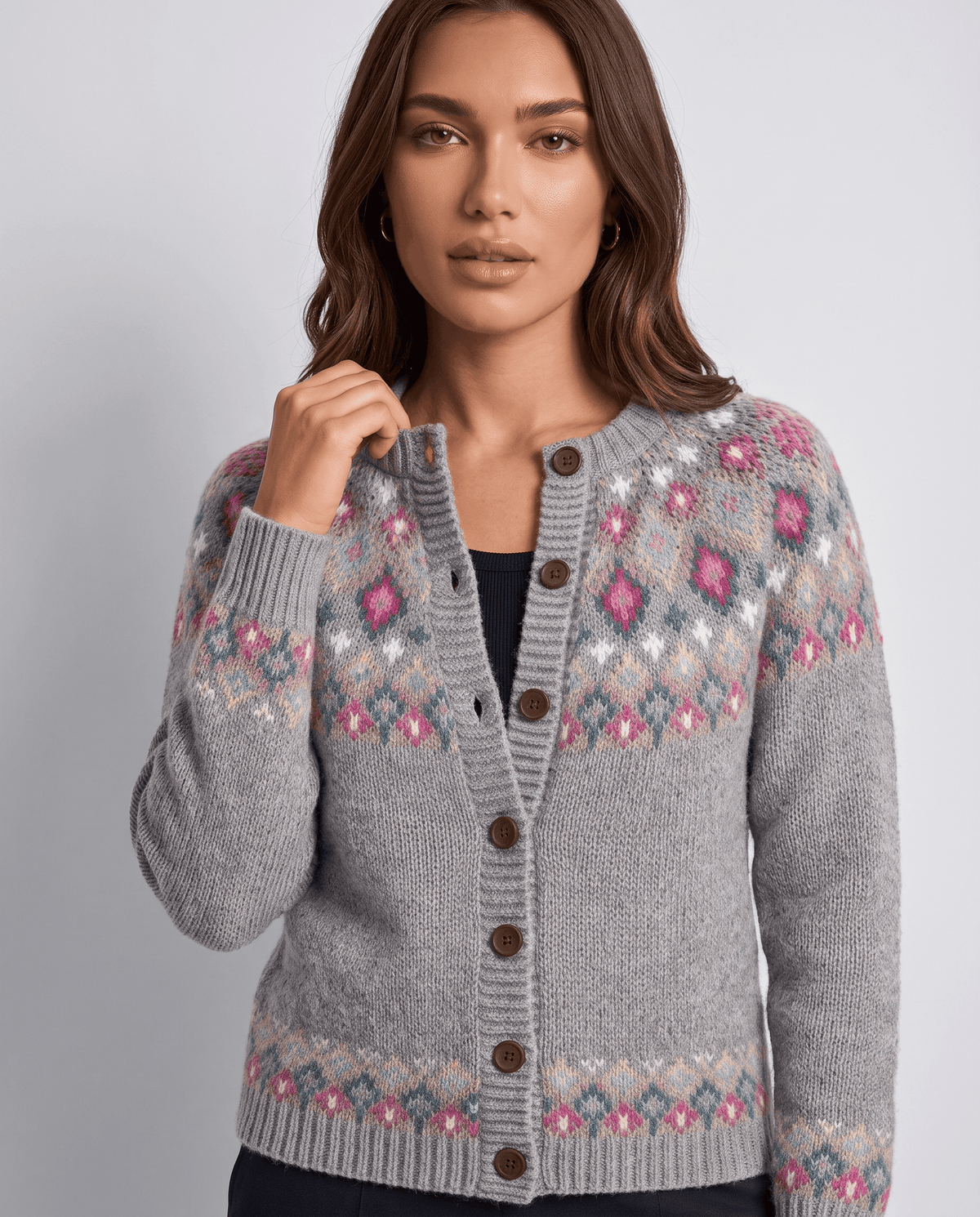 Close-up of gray Fair Isle yoke pattern with buttons and ribbed trim