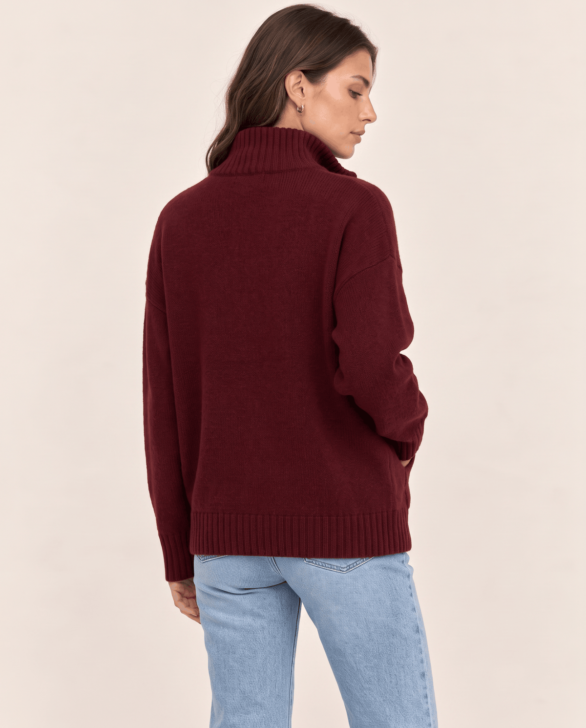Back view of a wine red cardigan showing the relaxed drop-shoulder shape
