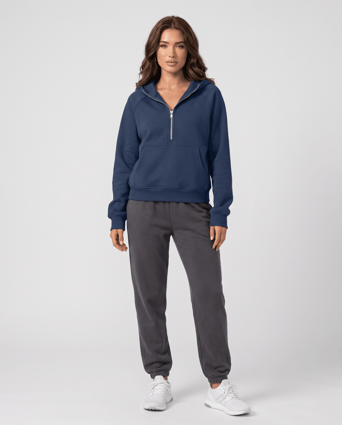Full-length look pairing the cropped navy hoodie with gray joggers