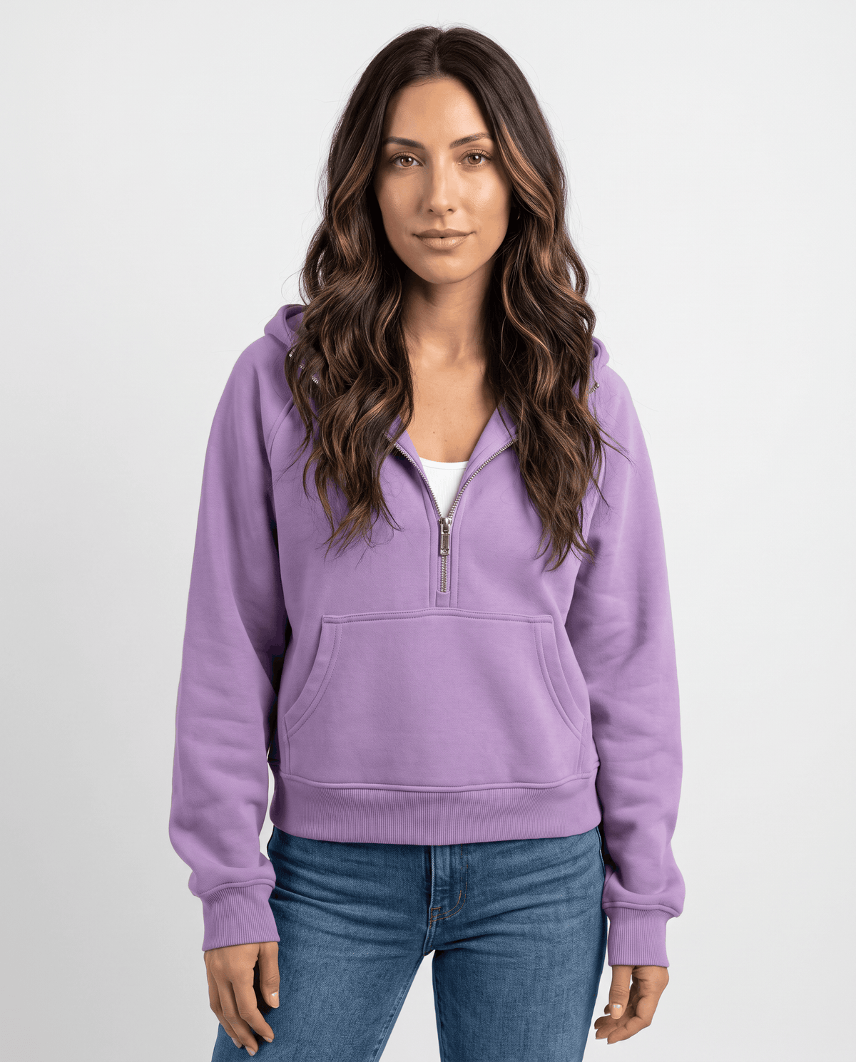 Purple cropped half zip hoodie worn with jeans, front view