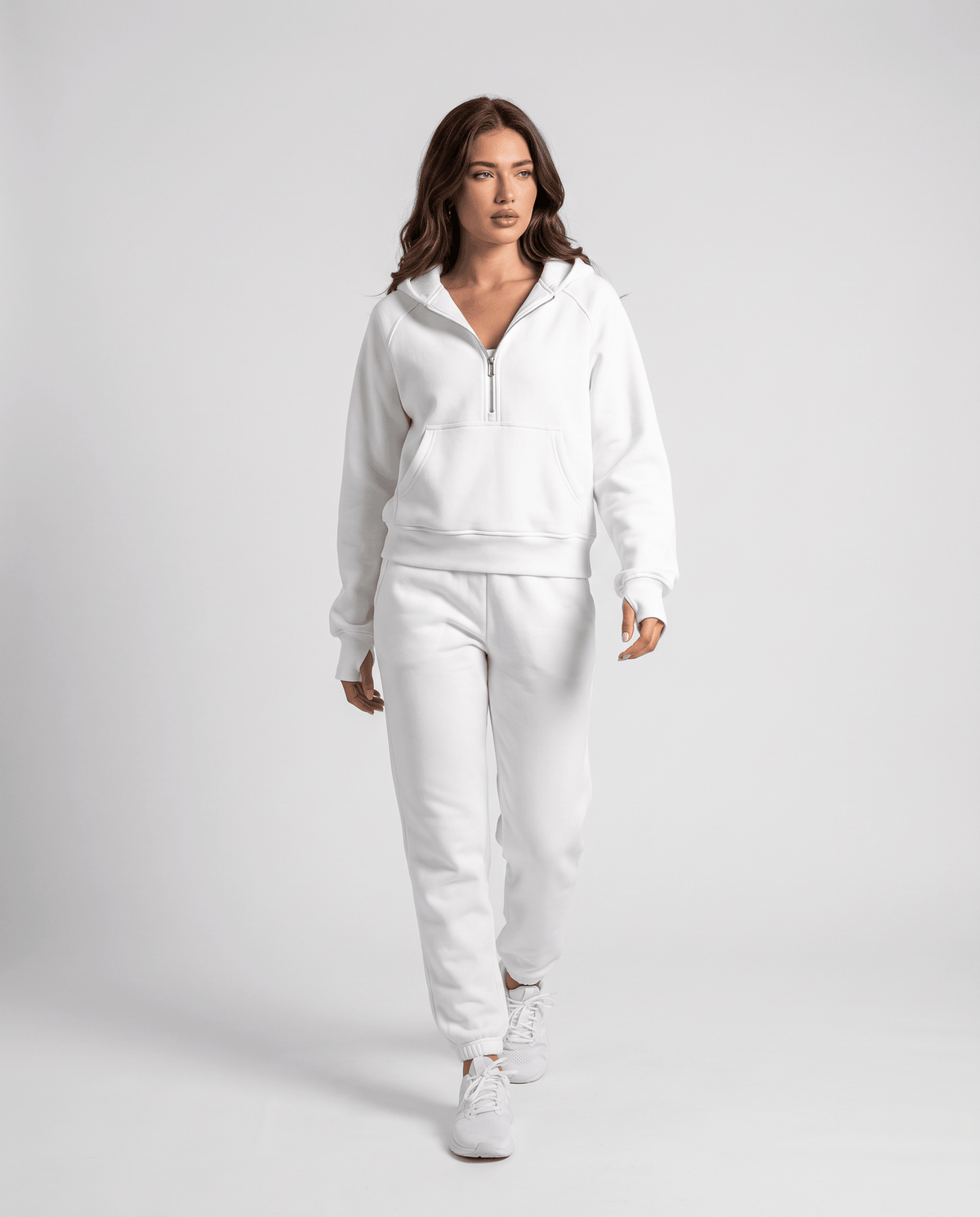 Full-length look pairing the white half zip hoodie with white joggers