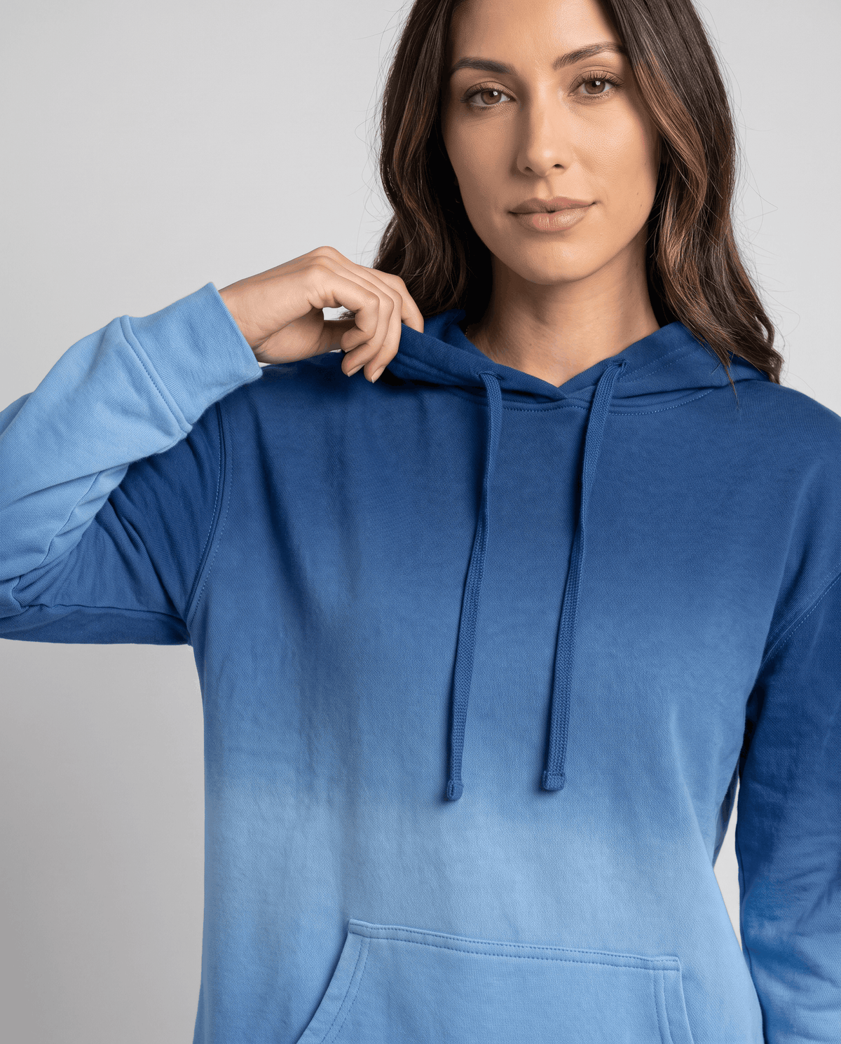 Blue fade pullover close-up showing drawstrings and the deep front pocket