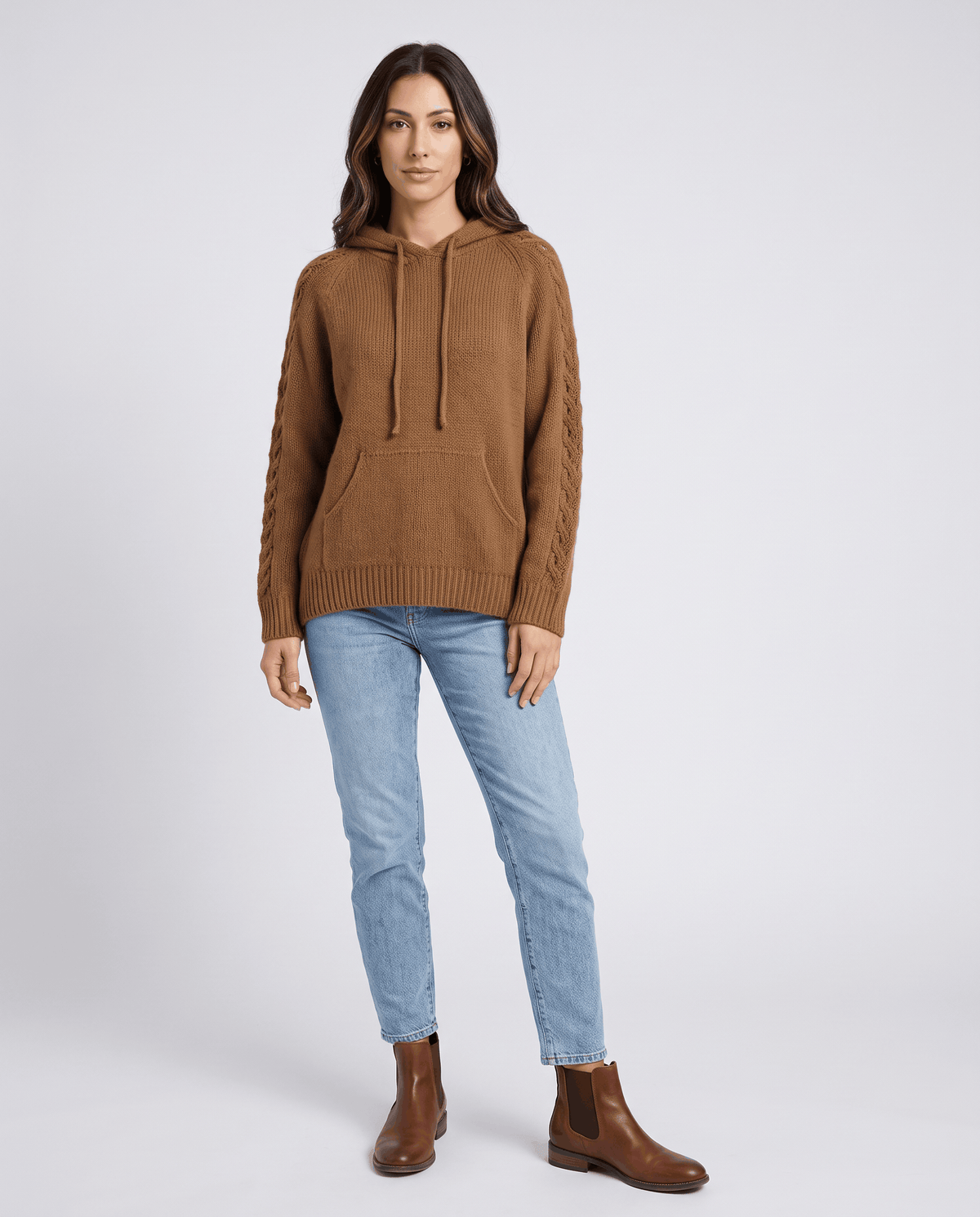 Full-length look styling the brown hooded sweater with light jeans and ankle boots