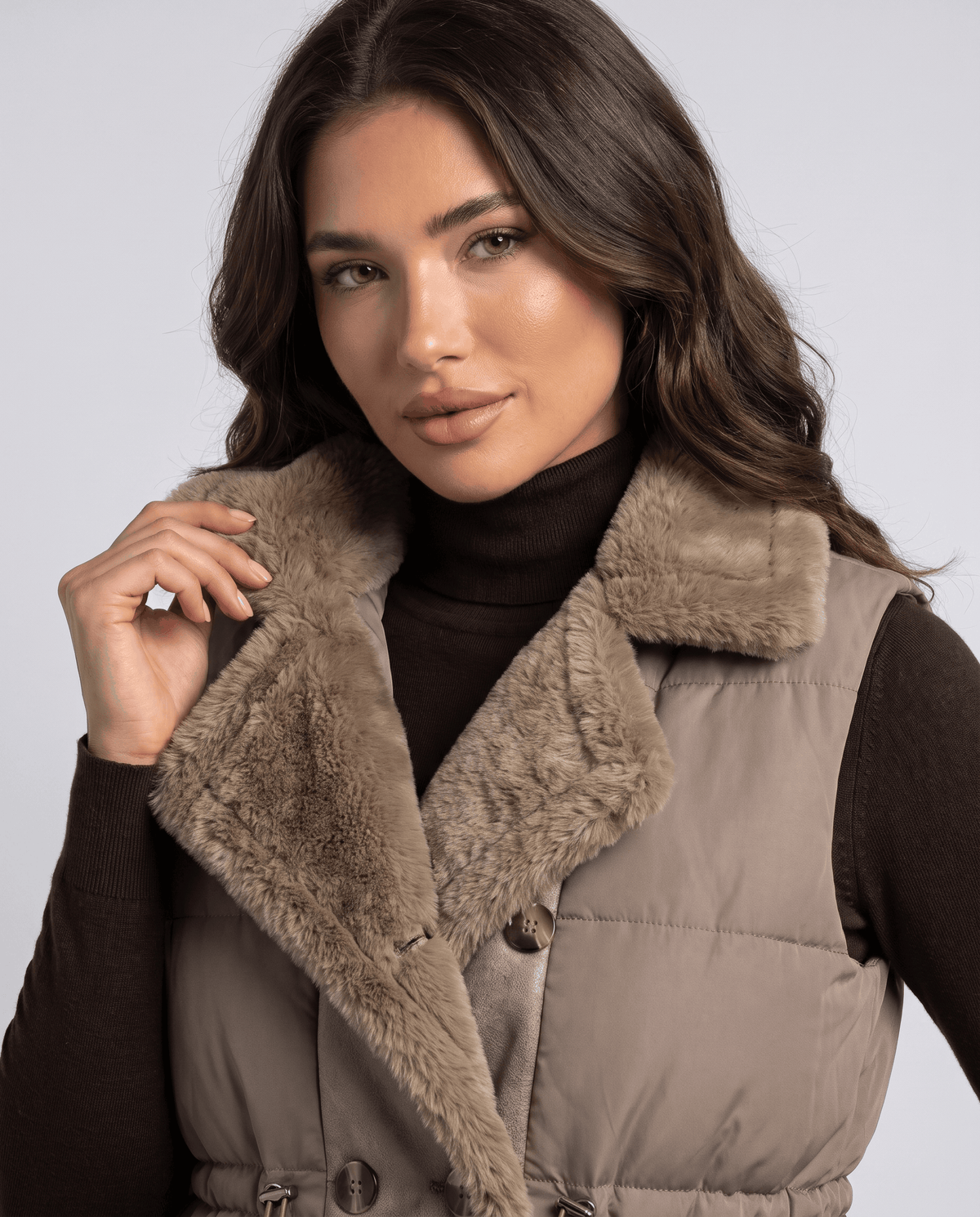 Khaki padded vest plush collar and button front shown in close view