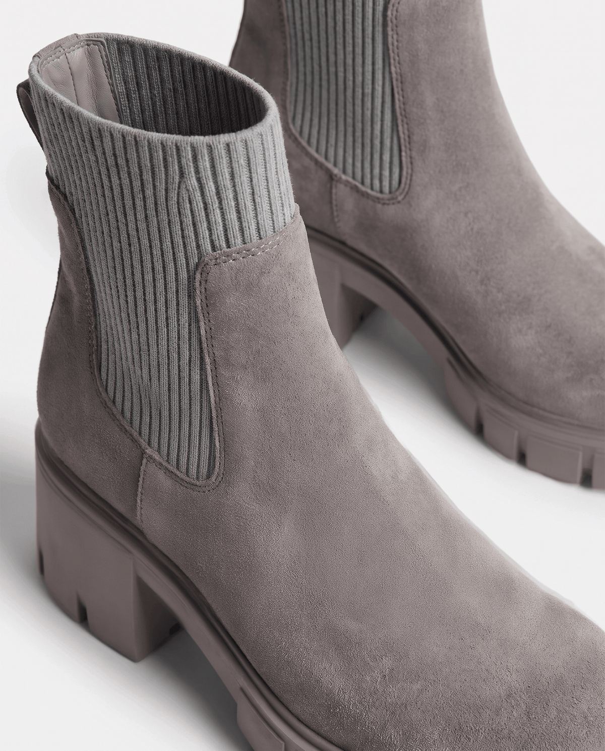 Gray suede boot showing the pull-on ribbed panel and lugged sole