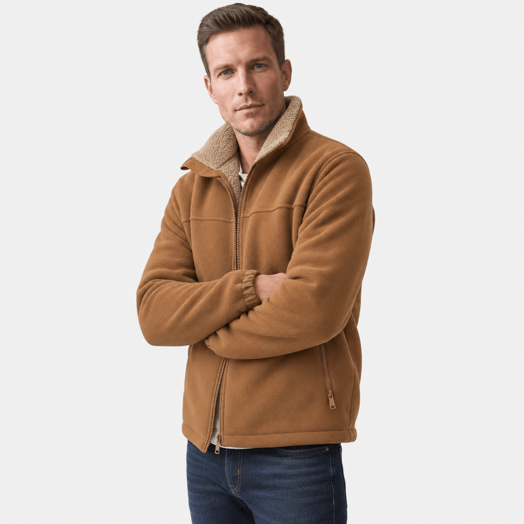 Male model wearing the camel brown jacket with arms crossed.