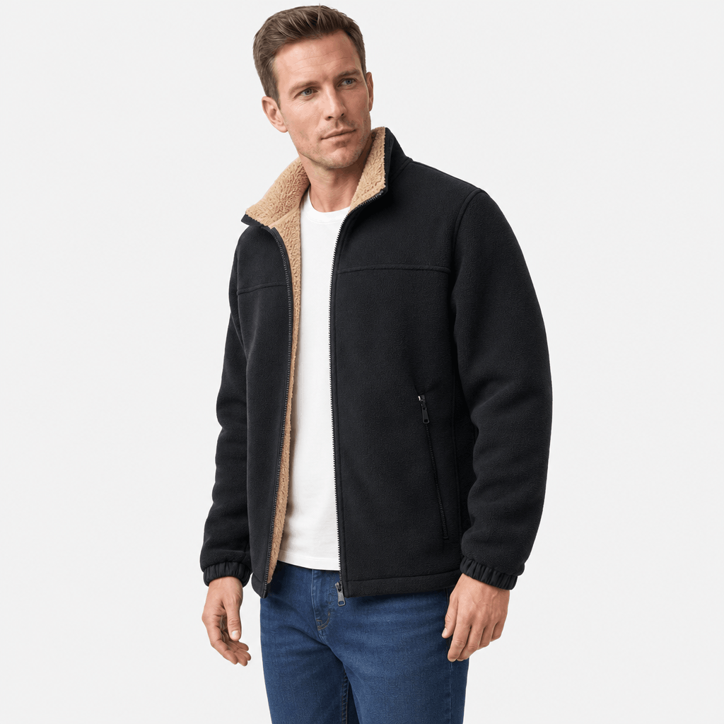 Male model wearing a black zip-up jacket with a contrasting beige stand collar.