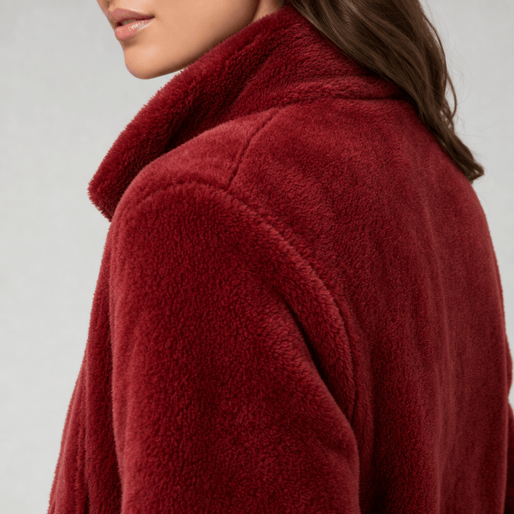 Back and side close-up of the deep red sherpa fleece jacket, highlighting the soft plush texture and high collar.