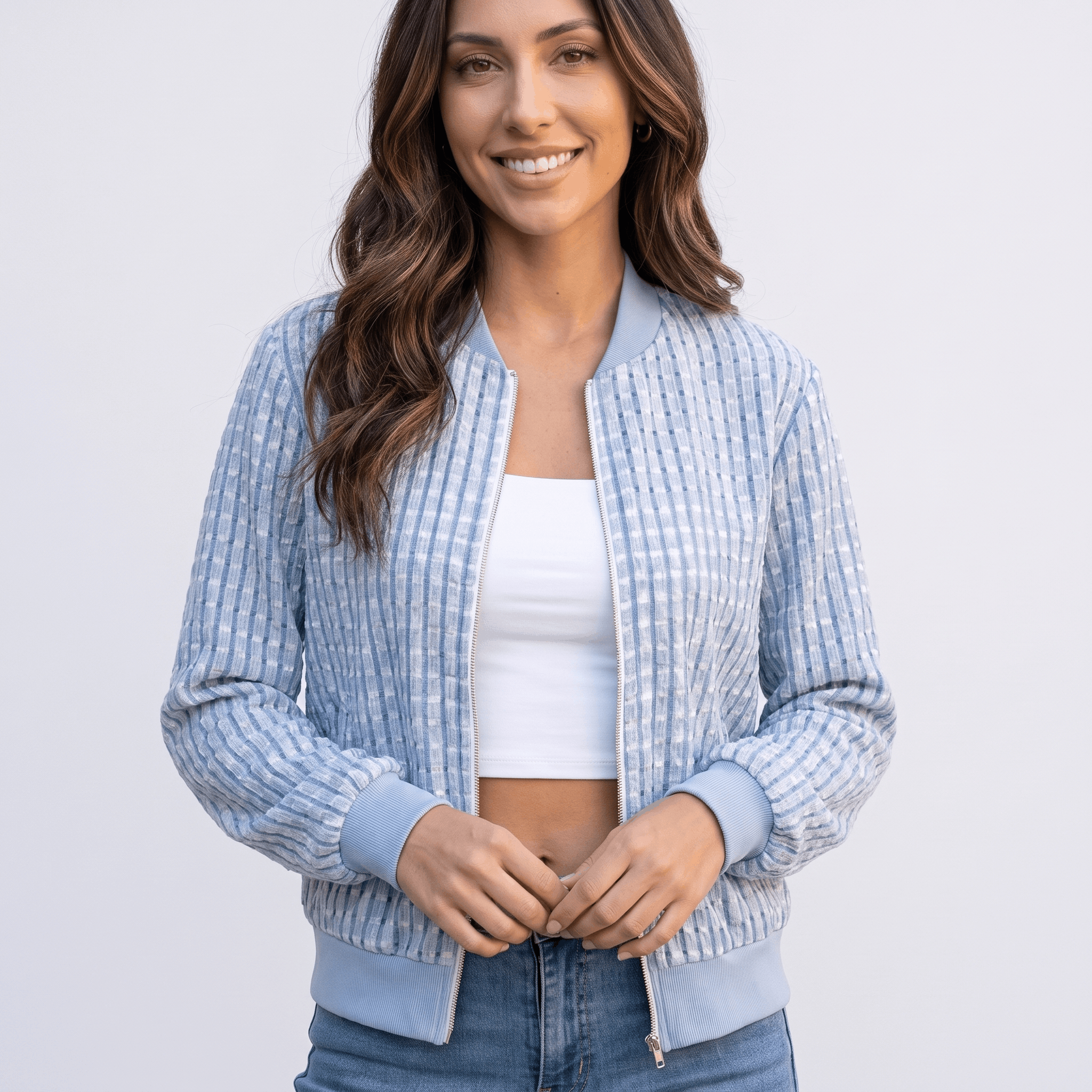 Female model wearing the light blue textured jacket, highlighting the stand collar, zipper, and woven texture.