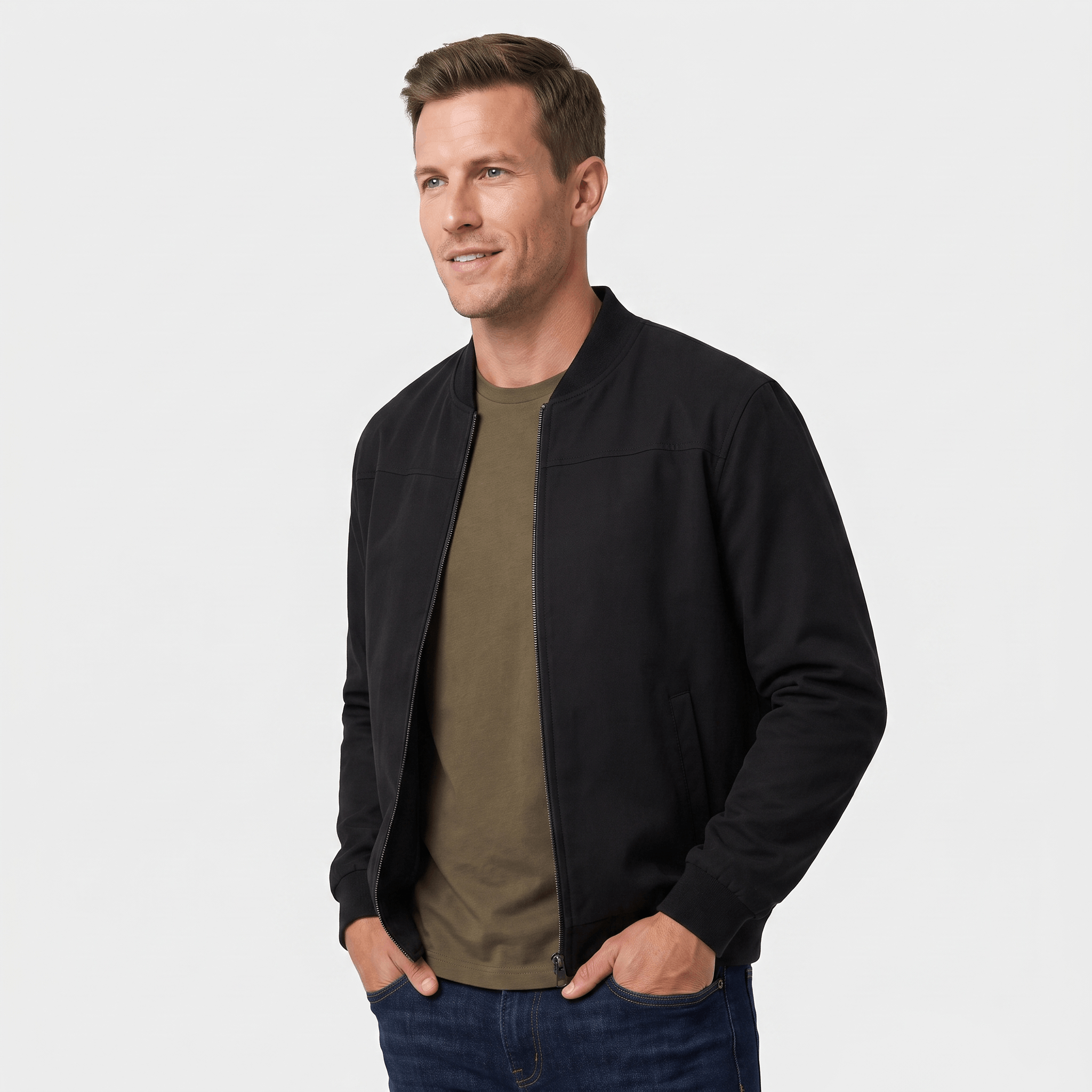 Male model wearing a black bomber jacket over an olive green shirt.