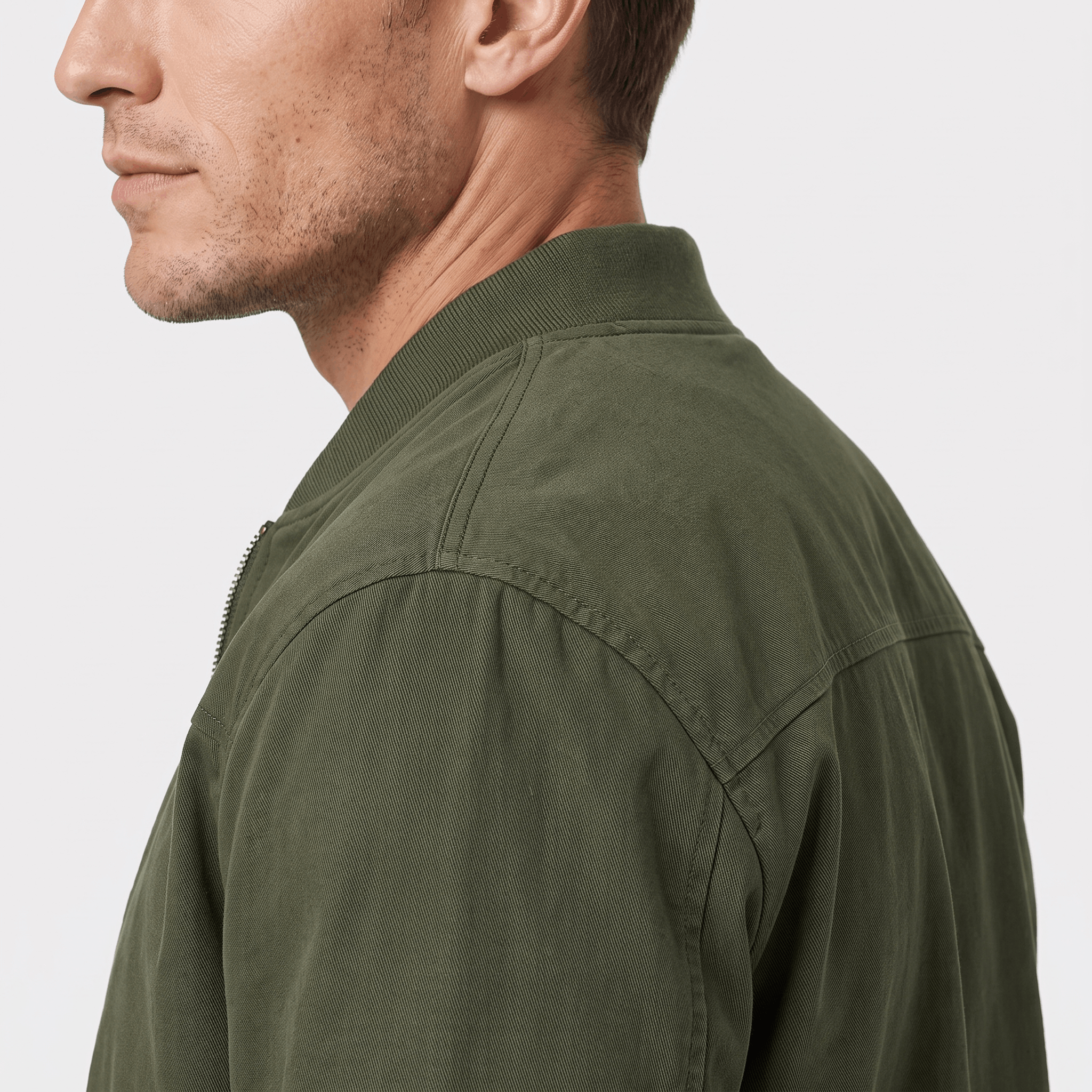 Side and back view of the olive green bomber jacket, highlighting the collar and shoulder seams.