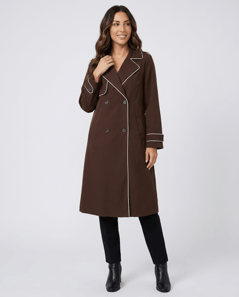 Brown belted trench coat for women worn by a female model, front view with defined waist and tie belt